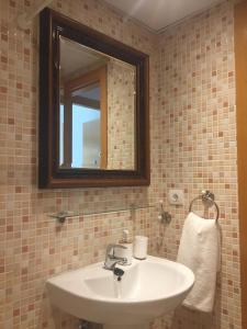 a bathroom with a sink and a mirror at Madre Mia Apartment in Casares