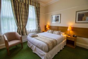 Ένα ή περισσότερα κρεβάτια σε δωμάτιο στο A Park View Hotel