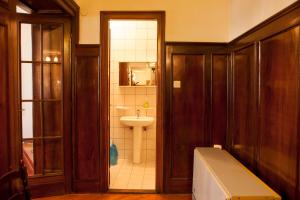 a bathroom with a sink and a toilet and a tub at Apartment Parliament park in Belgrade