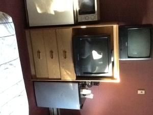 an apple tv sitting on top of a kitchen cabinets at Snowy River Inn in Show Low