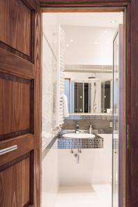 a bathroom with a sink and a mirror at Apartment Nearto Old Town Na Ustroniu street in Krakow