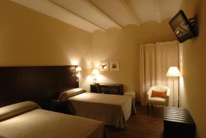 Postel nebo postele na pokoji v ubytování Molí Blanc Hotel