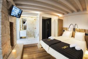 Ένα ή περισσότερα κρεβάτια σε δωμάτιο στο Spirito Santo Palazzo Storico