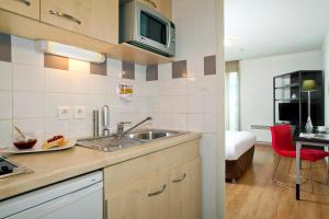 Kuchyň nebo kuchyňský kout v ubytování Residhome Metz Lorraine