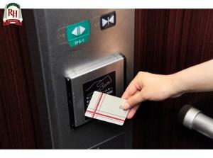 a hand is pushing a credit card into a machine at Richmond Hotel Tokyo Shiba in Tokyo