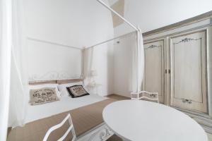 A bed or beds in a room at Nuvole Barocche