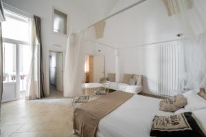 A bed or beds in a room at Nuvole Barocche