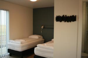 Postel nebo postele na pokoji v ubytování Brú Guesthouse