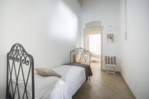A bed or beds in a room at Nuvole Barocche