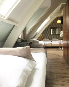 Voodi või voodid majutusasutuse Hotel Johannes Vermeer Delft toas