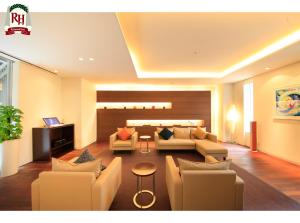a living room with a couch and chairs and a table at Richmond Hotel Tokyo Shiba in Tokyo