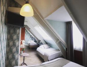 Voodi või voodid majutusasutuse Hotel Johannes Vermeer Delft toas