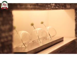 a shelf with three white plates with flowers in them at Richmond Hotel Tokyo Shiba in Tokyo