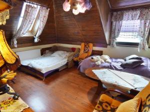 Postel nebo postele na pokoji v ubytování Domek nad rzeką