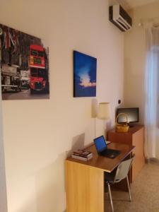 an office with a desk with a laptop on it at Bed & Breakfast Santa Caterina in Ercolano