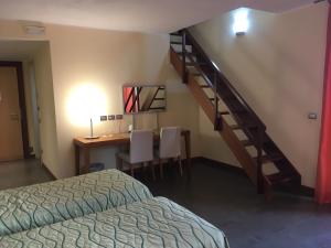 Postel nebo postele na pokoji v ubytování Hotel Langhe & Monferrato