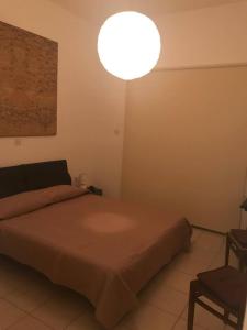 Katil atau katil-katil dalam bilik di Giorgio Vacation House