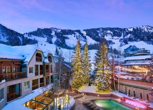 a resort with a pool in the snow at The Little Nell in Aspen