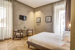 Posteľ alebo postele v izbe v ubytovaní G55 Design Hotel