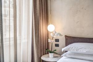 Posteľ alebo postele v izbe v ubytovaní G55 Design Hotel