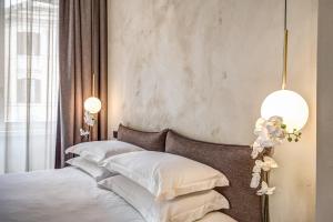 Posteľ alebo postele v izbe v ubytovaní G55 Design Hotel