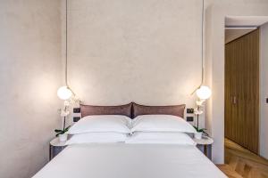 Posteľ alebo postele v izbe v ubytovaní G55 Design Hotel