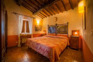 מיטה או מיטות בחדר ב-Fattoria Montalbano