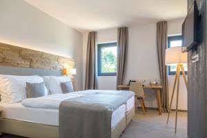 Voodi või voodid majutusasutuse Hostellerie Stafelter toas