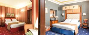 Postel nebo postele na pokoji v ubytování Hotel Manfredi Suite In Rome