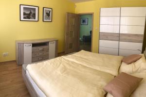 Postel nebo postele na pokoji v ubytování Apartman AiA