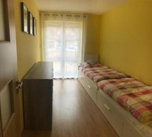Postel nebo postele na pokoji v ubytování Apartman AiA