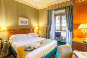 Postel nebo postele na pokoji v ubytování Hotel Manfredi Suite In Rome