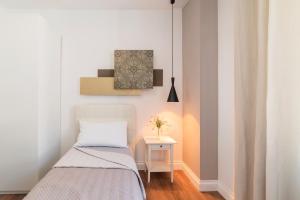 Postel nebo postele na pokoji v ubytování Guest Roma House