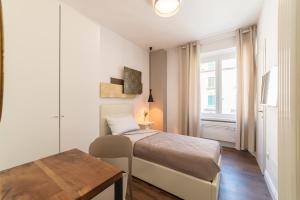 Postel nebo postele na pokoji v ubytování Guest Roma House