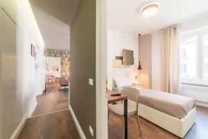 Postel nebo postele na pokoji v ubytování Guest Roma House