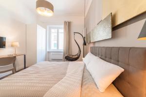 Postel nebo postele na pokoji v ubytování Guest Roma House