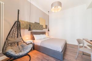Postel nebo postele na pokoji v ubytování Guest Roma House