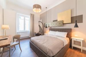 Postel nebo postele na pokoji v ubytování Guest Roma House