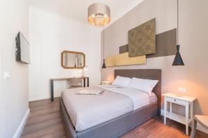 Postel nebo postele na pokoji v ubytování Guest Roma House