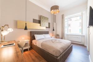 Postel nebo postele na pokoji v ubytování Guest Roma House