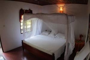 Postel nebo postele na pokoji v ubytování Nimal`s Homestay