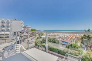 an apartment balcony with a view of a street at Hotel Austria in Caorle