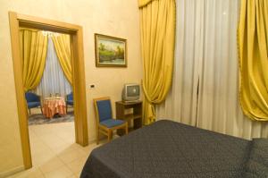 Katil atau katil-katil dalam bilik di Hotel Alba