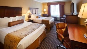 Postel nebo postele na pokoji v ubytování Best Western Plus Southpark Inn & Suites