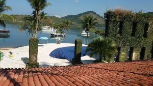 a tile roof of a house with a swimming pool at Casa Angra Itanema in Angra dos Reis