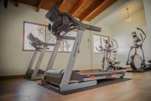 a gym with two exercise bikes and a treadmill at Hotel Del Angel in Apizaco
