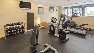 a gym with treadmills and elliptical machines at Best Western Fort Myers Waterfront in North Fort Myers