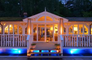 a large white gazebo with lights at night at Hotel Polar-Stern in Kühlungsborn