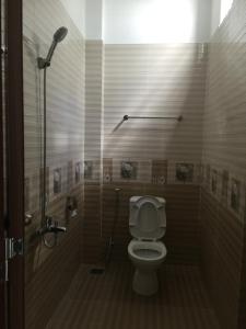 Koupelna v ubytování Phong Lan Guesthouse + 16 fotografií