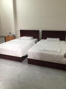 Postel nebo postele na pokoji v ubytování Phong Lan Guesthouse